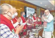  ?? PTI ?? Union home minister Amit Shah greets members from different groups of Assam in New Delhi on Saturday.