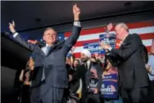  ?? TOM GRALISH — THE PHILADELPH­IA INQUIRER VIA AP ?? U.S. Sen. Bob Menendez celebrates his re-election in Hoboken, N.J., Tuesday while Gov. Phil Murphy stands at right.