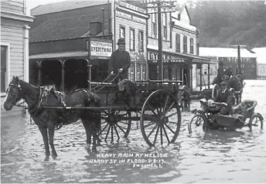  ?? FN JONES COLLECTION NELSON PROVINCIAL MUSEUM ?? Flooding in Hardy St, Nelson in August 1917. Parts of the city are flood-prone.