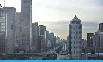  ?? —AFP ?? BEIJING: This picture taken on January 6, 2018 shows the Beijing Central Business District on a clear day.