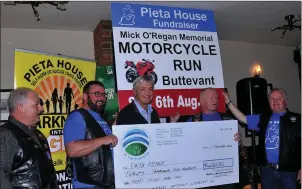  ??  ?? Connie Ryan, Tom Madden, Bertie O’Regan and Mike Palmer, organisers of the annual Mick O’Regan Memorial Motorcycle Run, presenting the proceeds from this years event to Pat Duffy of Pieta House (centre).