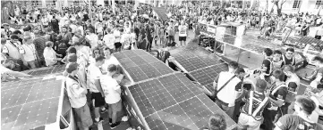  ??  ?? A general view as solar race cars prepare to leave the start line in Darwin. — AFP photo