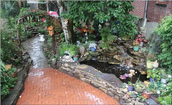  ?? MEDIANEWS GROUP FILE PHOTOS ?? A Pottstown residence includes an expansive home garden with many different features including a pond. The 8th Annual Home Garden Contest has two new categories including an “Outdoor Oasis” category.