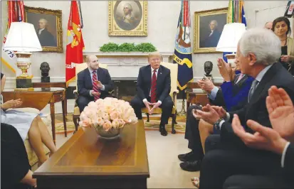  ?? AP PHOTO ?? President Donald Trump speaks as he sits with Joshua Holt, left, who was recently released from a prison in Venezuela, with Sen. Bob Corker, R-tenn., right, and others, in the Oval Office of the White House.