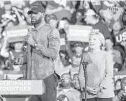  ?? Phil Long / Associated Press ?? Cleveland Cavaliers star LeBron James campaigns with Hillary Clinton on Sunday in Ohio.