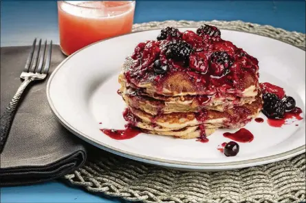  ?? CHICAGO TRIBUNE/TNS PHOTOS BY ZBIGNIEW BZDAK/ ?? Using frozen berries is a shortcut that means you can always have the ingredient­s on hand to make these pancakes.