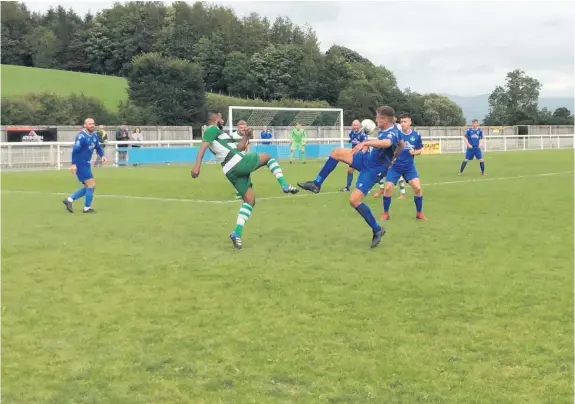  ?? MIKE SNOWDON ?? ■ Penrith and West Allotment Celtic players do battle during yesterday’s FA Cup clash, which saw Celtic win 3-1 in Cumbria