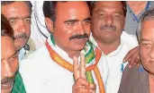  ?? — PTI ?? Congress candidate Brijendra Singh Yadav with his supporters flashes victory sign after winning Mungaoli bypolls Assembly elections, in Ashok Nagar District Madhya Pradesh on Wednesday.
