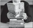  ?? RICK BOWMER/AP FILE PHOTO ?? A pile of challenged books appears at the Utah Pride Center in Salt Lake City in 2021.