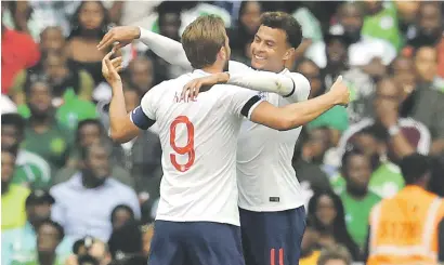  ?? Picture: AFP ?? CAPTAIN FANTASTIC. England skipper Harry Kane celebrates with team-mate Dele Alli after Kane scored the winner in their 2-1 win over Nigeria at Wembley on Saturday.