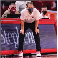  ?? (University of Arkansas/Gunnar Rathbun) ?? Arkansas Coach Eric Musselman, shown during the Razorbacks’ game against Oral Roberts on Sunday, did not attend Tuesday’s game against Abilene Christian for contact tracing reasons after a staff member tested positive for covid-19. Musselman watched the game on TV from home.