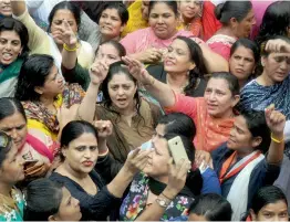  ?? — BIPLAB BANERJEE ?? Actress Nagma and Mahila Congress activists takes part in a protest in New Delhi on Tuesday against the Centre’s ‘anti-women’ policies.