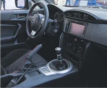  ??  ?? Inside, the BRZ has new trim and materials, as well as a rear-view camera.