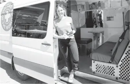  ?? ADRIAN LAM, TIMES COLONIST ?? Mobile clinic nurse and co-ordinator Maude Blanchette Lamothe with the Doctors of the World van that has been running since April and was officially unveiled on Wednesday. “We try to be a bridge between the street and the public health system,” she said.