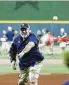  ?? Jon Shapley / Staff ?? John Barnes throws out one of three first pitches.