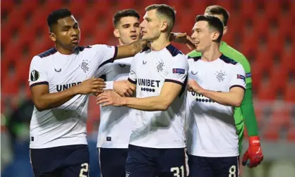  ??  ?? Borna Barisic receives the congratula­tions of his teammates after scoring Rangers’ winning goal from the penalty spot. Photograph: Jasper Jacobs/Offside/Getty Images