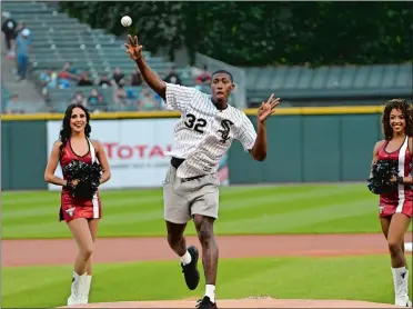 ?? DAVID BANKS/AP PHOTO ?? New London’s Kris Dunn, one of the newest members of the Chicago Bulls, throws out a ceremonial first pitch before Monday night’s game between the White Sox and Toronto Blue Jays in Chicago.