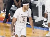  ?? Jared C. Tilton / Getty Images ?? Anthony Polite of Florida State celebrates a 3-point basket during the second half against North Carolina in the ACC tourney semifinals on Friday.