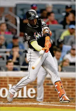  ?? MIKE ZARRILLI / GETTY IMAGES ?? Marlins left fielder Marcell Ozuna, who is expected to make $11 mllion next season through salary arbitratio­n, could be on the trading block.