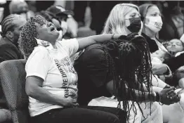  ?? Gerry Broome / Associated Press ?? Relatives weep Monday at the funeral for Andrew Brown Jr. in Elizabeth City, N.C. Brown was killed by Pasquotank County deputies trying to serve a warrant.