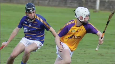  ??  ?? James Kelly of South Wexford gets the better of Tipperary South’s Fiachra Scott.