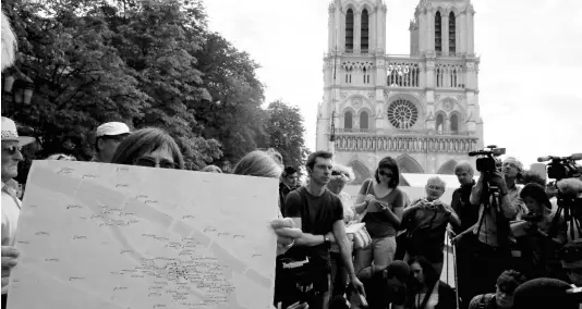  ?? AP PHOTOS ?? Environmen­tal groups and unionists attend a news conference to warn against lead particles polluting the air in the area, and ask for a regularly updated chart showing pollution levels in Paris, France, Monday, August 5, 2019. Hundreds of tons of toxic lead in Notre Dame’s spire and roof melted during the April fire.