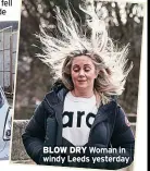  ?? ?? BLOW DRY Woman in windy Leeds yesterday