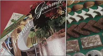  ?? JANET PODOLAK — FOR THE NEWS-HERALD ?? Past years editions of Gourmet magazine, which ceased publishing in 2009, prove perfect for recipe research.