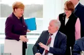  ??  ?? German interior minister Horst Seehofer turns away Angela Merkel’s offer of a handshake