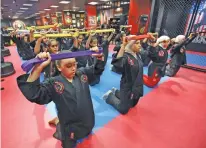  ??  ?? A Kajukenbo training session in a club in Kuwait City