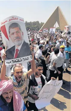  ?? REUTERS ?? Supporters of deposed president Mohamed Morsi rally near the Tomb of the Unknown Soldier at Rabaa Adawiya Square, Cairo, on Saturday.