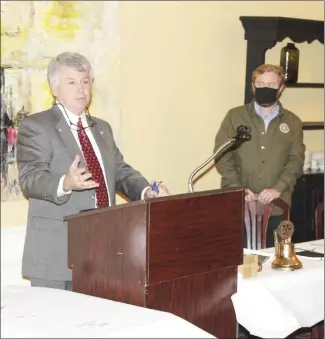  ?? Katie West • Times-Herald ?? Rotary Club Arkansas District Director Mike Bennage, left, speaks to the Rotary Club of Forrest City during their 100 Years celebratio­n Thursday. Rotary Club of Forrest City president Drew Higginboth­om, right, told fellow Rotarians to begin thinking of projects the club could do for the Forrest City community to celebrate being together for 100 years.