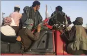  ?? RAHMAT GUL — THE ASSOCIATED PRESS FILE ?? Taliban fighters ride in their vehicle in Surkhroad district of Nangarhar province, east of Kabul, Afghanista­n.