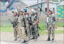  ?? PTI ?? Security personnel celebrate after foiling a suicide attack on a CRPF camp in Jammu and Kashmir’s Bandipora district on Monday. Four armed militants who tried to enter the camp were killed.