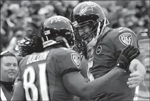  ?? AP/NICK WASS ?? Baltimore Ravens wide receiver Anquan Boldin (81) celebrates his touchdown catch with quarterbac­k Joe Flacco (5) during the fourth quarter of Sunday’s wild-card playoff game against the Indianapol­is Colts in Baltimore. Boldin had five catches for 145...