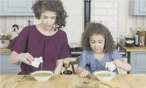  ??  ?? Pru Irvine, right, and Mary Contini, far right, are the authors of Easy Peasy!, inset, a cookery book which encourages children to learn to make healthy, nutritious and tasty dishes