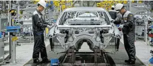  ?? Picture: THANH HUE ?? LONG WAY FOR SA: Technician­s at work in an automotive factory in Hai Phong City, Vietnam.