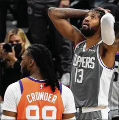  ?? MARK J. TERRILL / ASSOCIATED PRESS ?? Clippers guard Paul George (right) reacts after being charged with a foul during Game 4 in the NBA Western Conference finals on Saturday night in Los Angeles. George scored 21 points but was 5 of 20 from the field and made only one of his nine 3-point attempts.