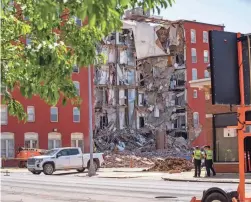  ?? ZACH BOYDEN-HOLMES/DES MOINES REGISTER FILE ?? Iowa Gov. Kim Reynolds issued an emergency proclamati­on the day after the Davenport, Iowa, building’s partial collapse to deploy state resources to the response.