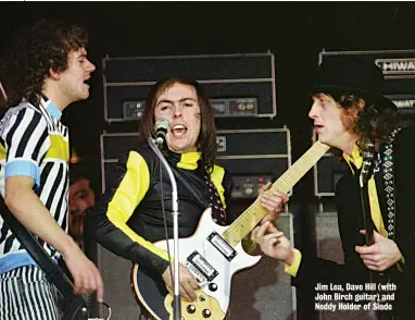  ??  ?? Jim Lea, Dave Hill (with John Birch guitar) and Noddy Holder of Slade