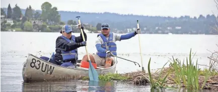  ?? PUGET SOUNDKEEPE­R ALLIANCE VIA AP ?? Volunteers with the Puget Soundkeepe­r Alliance look for marine debris in Washington state’s Puget Sound during an annual cleanup day in 2018.