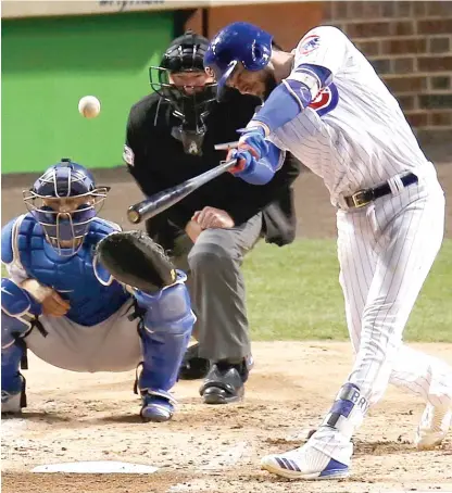  ?? | CHARLES REX ARBOGAST/ AP ?? The Cubs’ Kris Bryant singles in the third inning of Game 3 of the NLCS on Tuesday atWrigley Field.