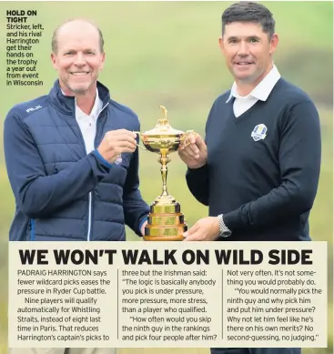  ??  ?? HOLD ON TIGHT Stricker, left, and his rival Harrington get their hands on the trophy a year out from event in Wisconsin