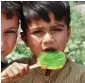  ?? APP ?? A young boy relishes on an icelolly in Islamabad on Sunday to beat the heat as temperatur­es have started rising across Pakistan. —