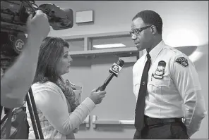  ?? AP/ DAKE KANG ?? Cleveland Police Chief Calvin Williams speaks to a reporter Tuesday after a news conference in Cleveland. The police officer who shot and killed 12- year- old Tamir Rice was fi red Tuesday for inaccuraci­es on his job applicatio­n, Williams announced...