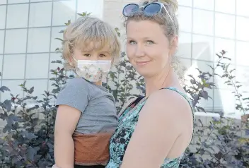  ?? MICHAEL BELL ?? Erica Honoway holds her son Lincoln, who was diagnosed with aplastic anemia last year, but a bone marrow transplant helped save his life.