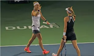  ??  ?? Ekaterina Makarova and Elena Vesnina celebrate their win in the Women’s Double finals.