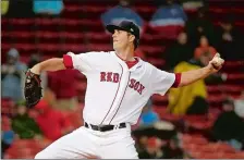  ?? MARY SCHWALM/AP PHOTO ?? Red Sox starting pitcher Drew Pomeranz delivers during the first inning of Thursday’s game against the Rangers at Fenway Park.