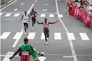  ??  ?? Netherland­s’ Abdi Nageeye (right) celebrates as he runs to the finish line in second place ahead of third-placed Bashir Abdi (left) and fourth-placed Lawrence Cherono. Photograph: Charly Triballeau/AFP/ Getty Images