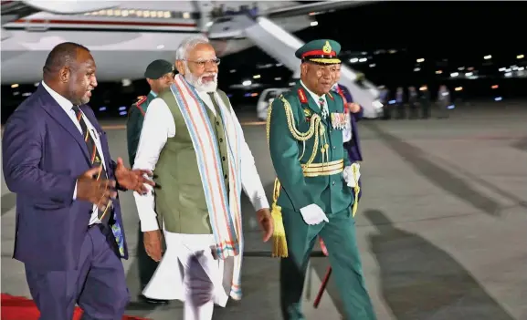  ?? Photo: RNZ Pacific ?? India Prime Minister Narendra Modi being received by Prime Minister of Papua New Guinea James Marape, (left), at Port Moresby on Sunday.